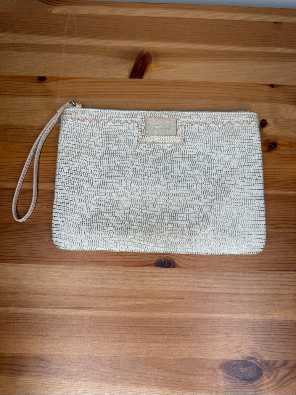 Stella & Dot cream and metallic wristlet